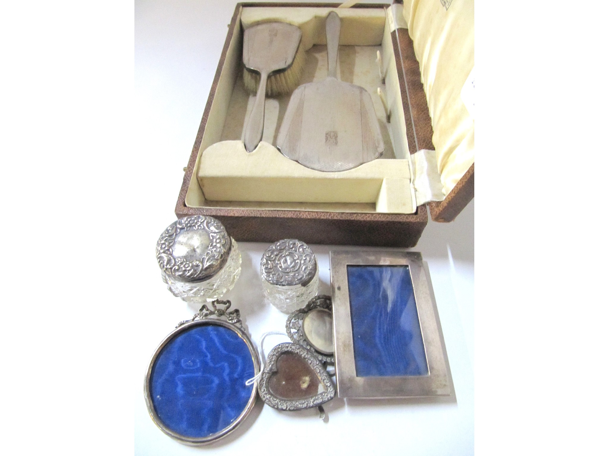 A lot comprising a cased silver dressing table set two