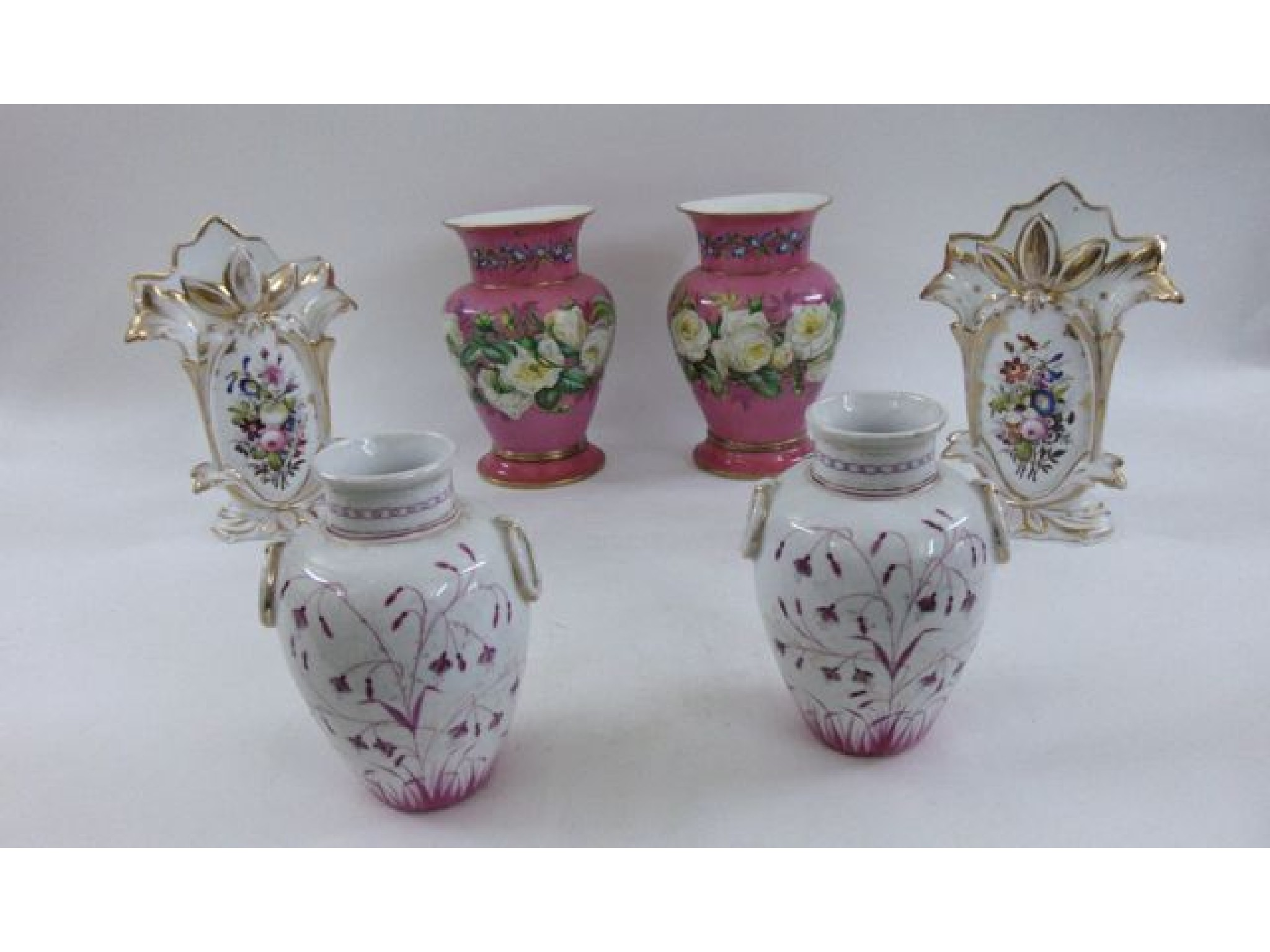 A pair of 19th century continental oviform vases the pink