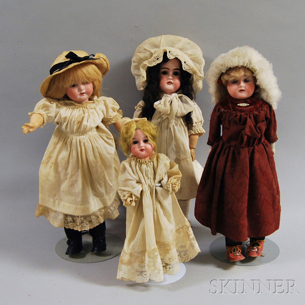 Four Bisque Head Girl Dolls one marked Made in Germany