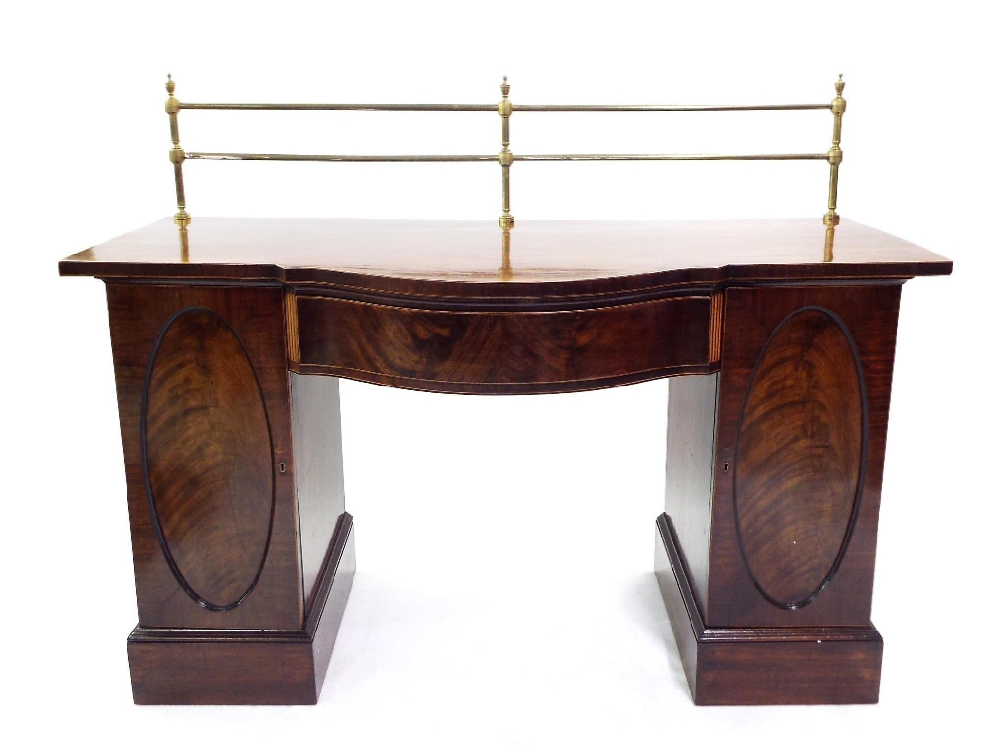 19th century flame mahogany serpentine pedestal sideboard with raised twin