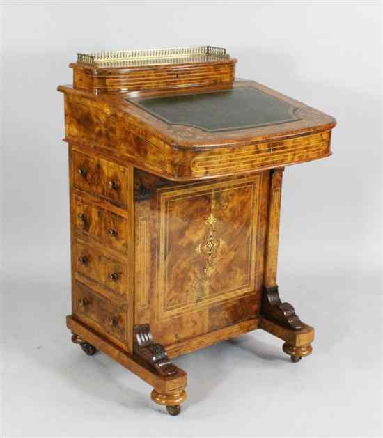 A Victorian inlaid burr walnut Davenport with slope above four