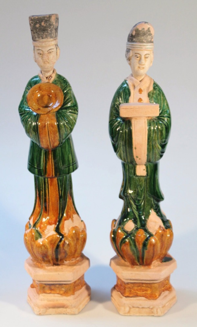 A pair of Chinese terracotta tomb attendees formed as a