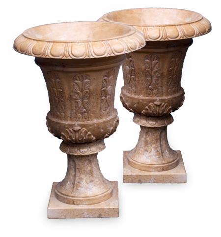 A pair of modern marble urns and plinths each urn