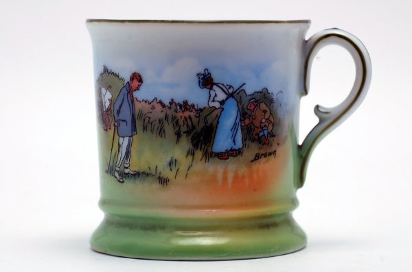 19th century porcelain mug with scenes of early golfing including