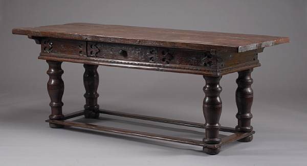 An Italian Baroque style mixed wood table composed of antique