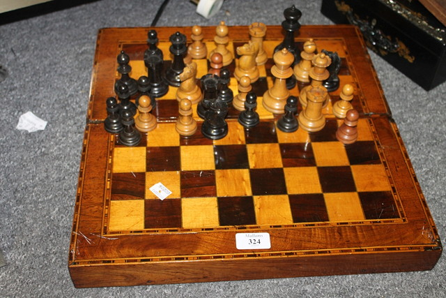 A VICTORIAN MAHOGANY INLAID FOLDING BACKGAMMON AND CHEQUER BOARD GAMES