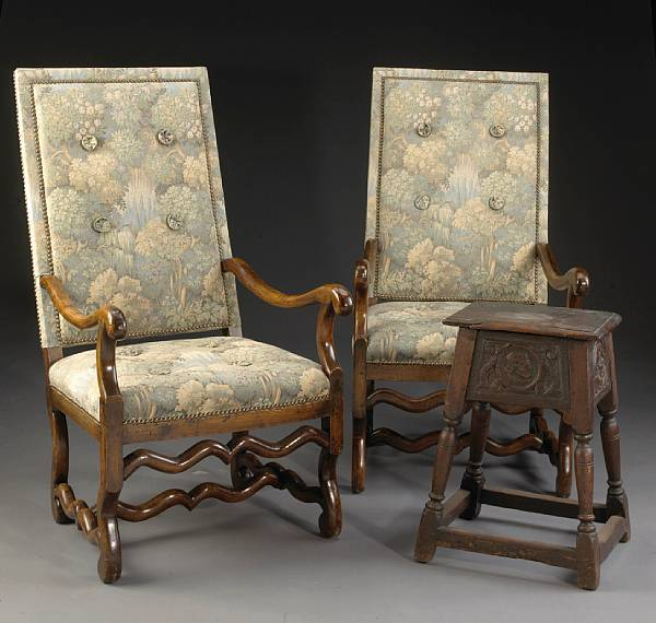 A pair of Italian Baroque walnut armchairs together with a