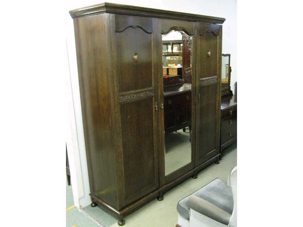 Oak Jacobean style bedroom suite comprising triple wardrobe dressing table