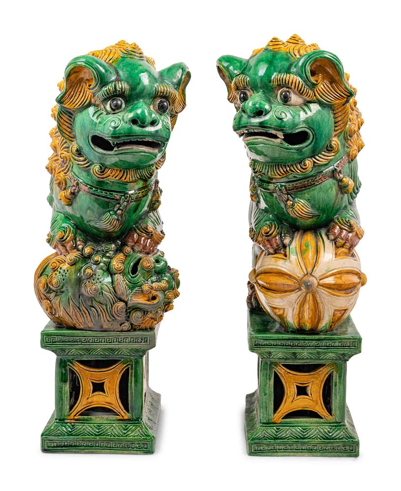 A Pair of Chinese Sancai Glazed Porcelain Figures of Fu