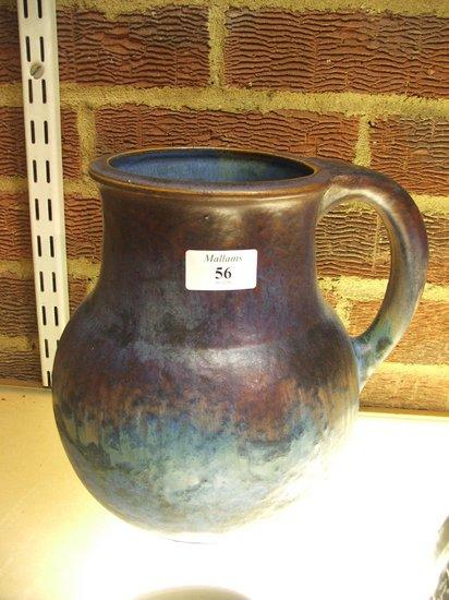 A DENBY WARE POTTERY JUG of baluster form with loop