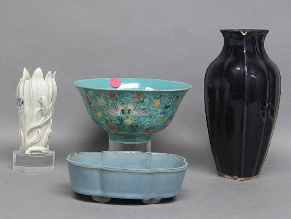 A group of four ceramics Including a lobed vase with