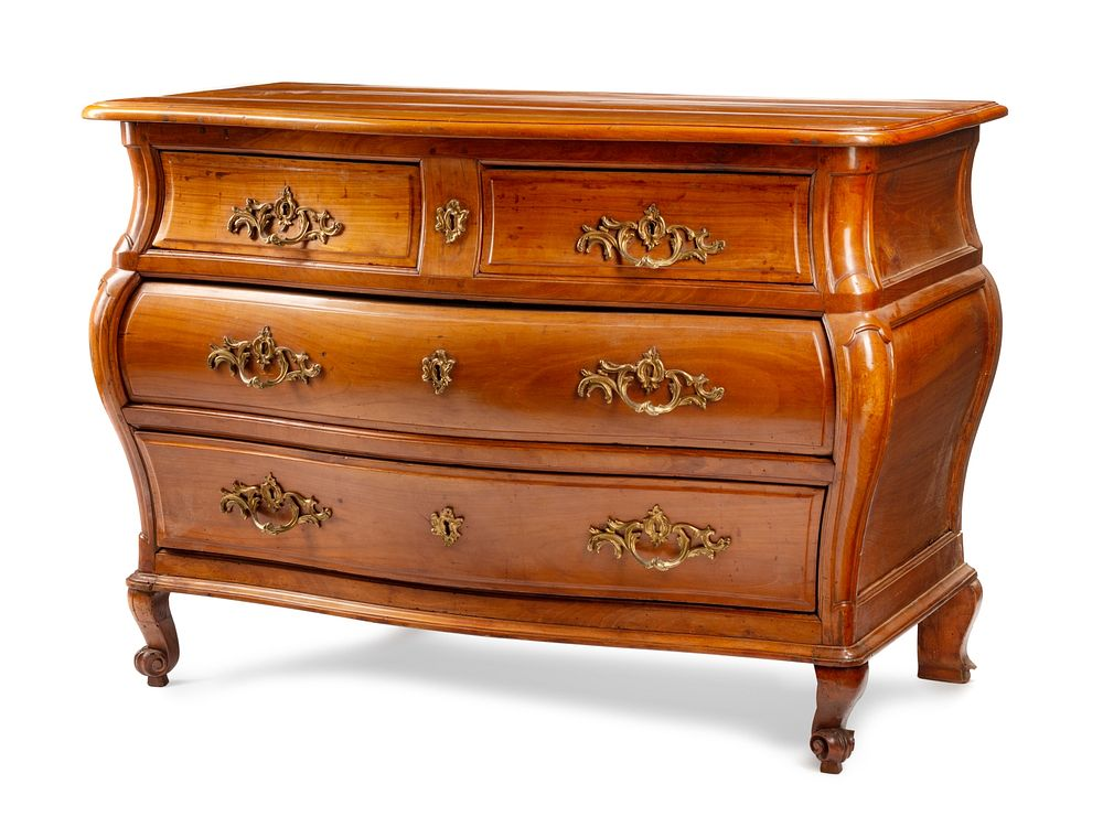 A French Provincial Walnut Bombe Commode A French Provincial Walnut