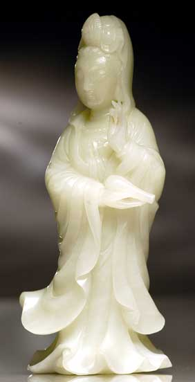 CARVED CELADON JADE GUANYIN Finely detailed Chinese carved celadon jade