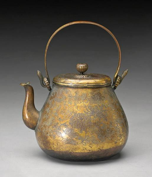 A gilt copper pouring vessel 19th Century The pear shape