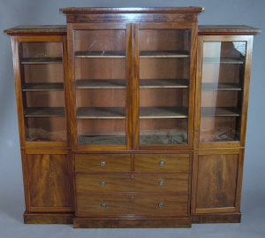 A George IV mahogany breakfront library bookcase the central moulded