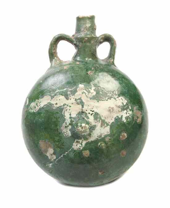 A Middle Eastern Green Glaze Pottery Flask of circular form