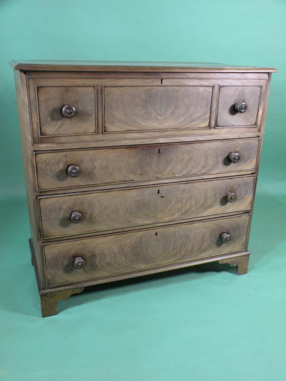 An early Victorian mahogany secretaire chest the cross banded top
