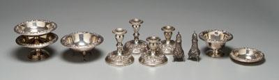 Eleven pieces sterling repousse items candlesticks compotes footed bowls casters