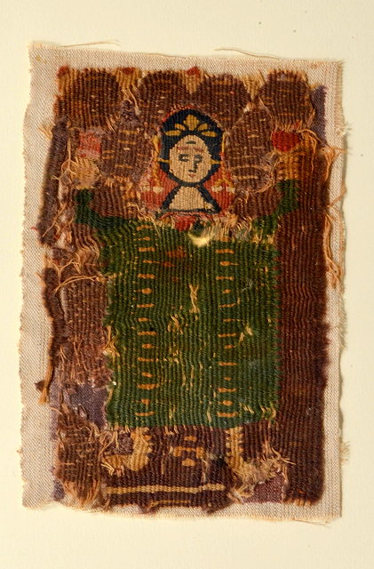 A RECTANGULAR PANEL depicting a female figure within a bed