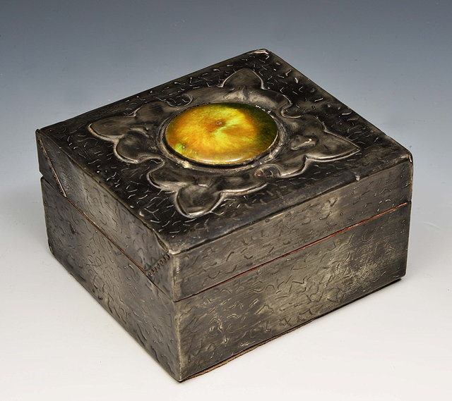 An Arts and Crafts pewter box with stylised leaf design