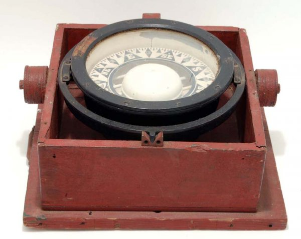 A gimbaled ship s compass Cream painted interior with directional