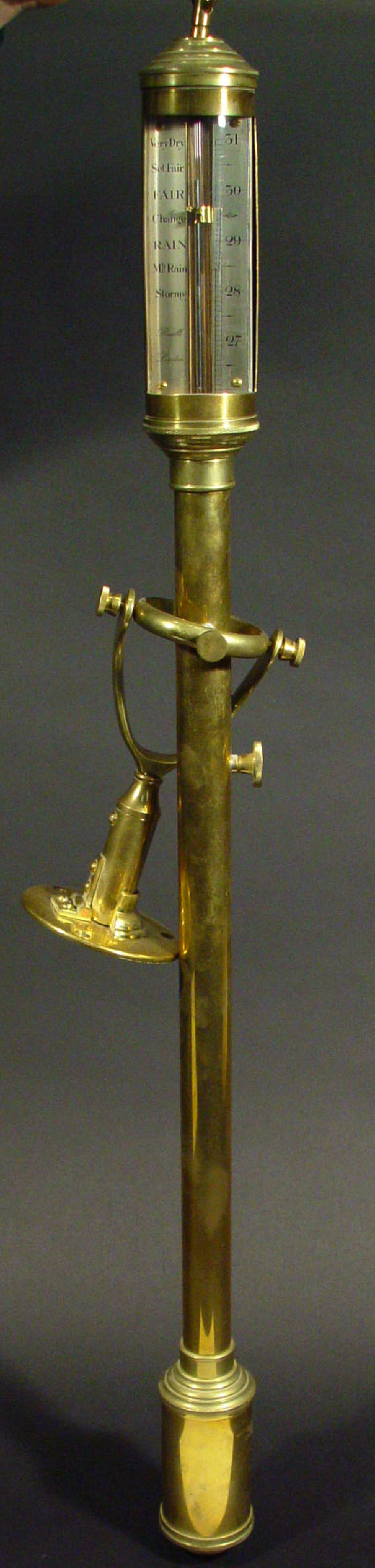 Brass ship s barometer with brackets the silver dial inscribed