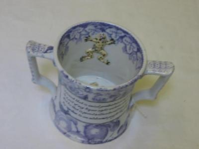A VICTORIAN POTTERY FROG LOVING CUP of waisted form black