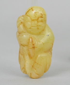 A Chinese Carved Jade Ornament of a Boy A Chinese
