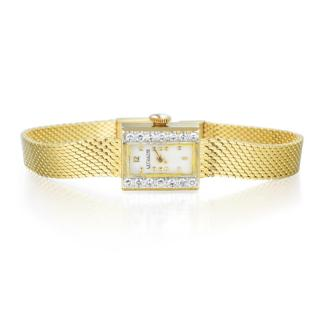 Jaeger Featuring a rectangular 14K yellow gold case accented with