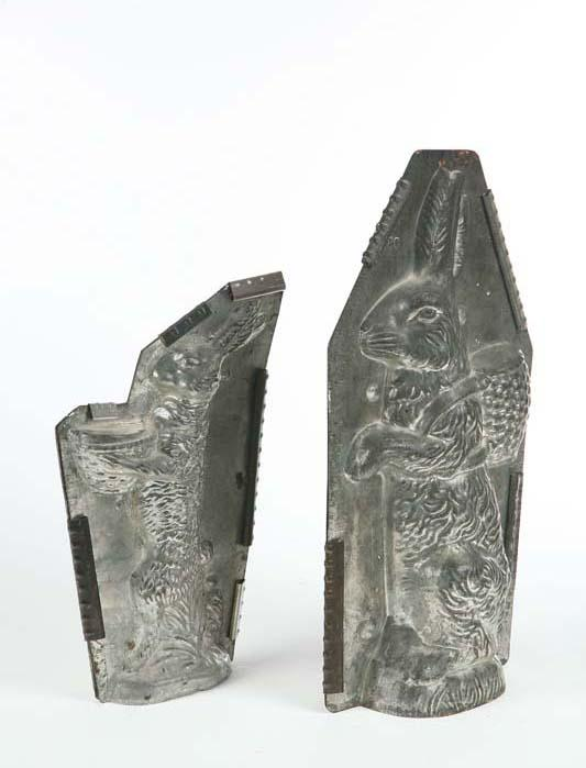 TWO CHOCOLATE MOLDS Tin with metal straps A seated rabbit