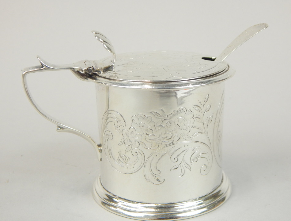 A Victorian silver mustard pot the barrel shaped body with