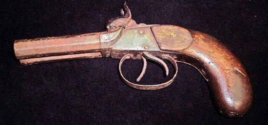 A double barrelled percussion cap pistol with octagonal screw off