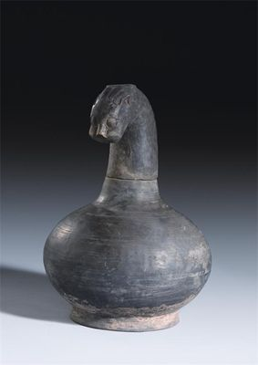 A Chinese black pottery zoomorphic jar and cover the finial