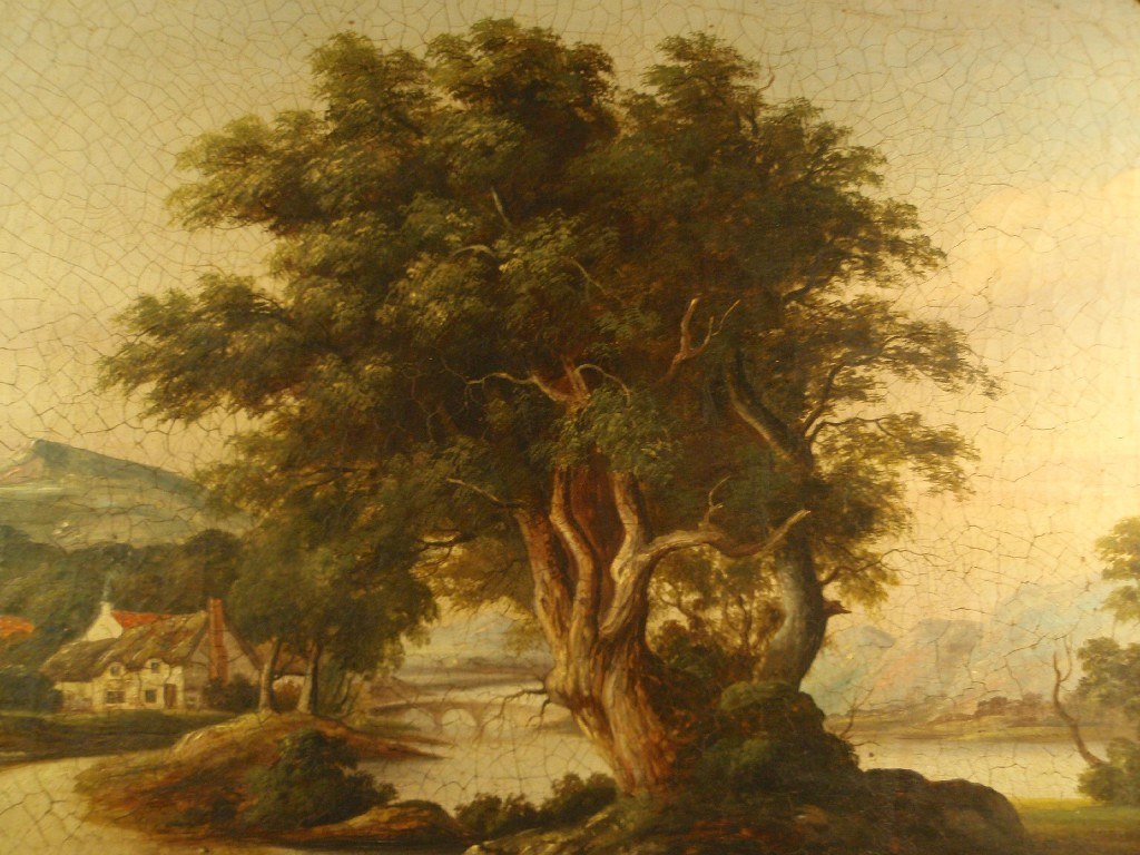 19th Century School River landscape with cottages beyond an aged