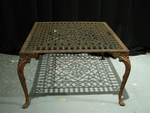 WROUGHT IRON GARDEN TABLE The square pierced top rasied on