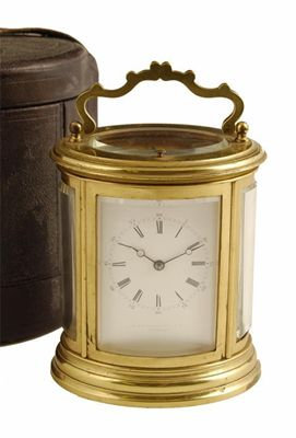 A French gilt brass oval repeating carriage clock by Drocourt