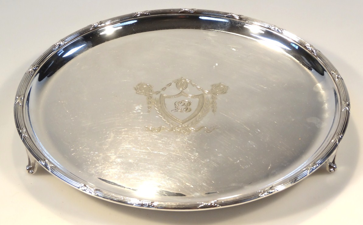 An early 20thC silver plated salver the 32cm dia body