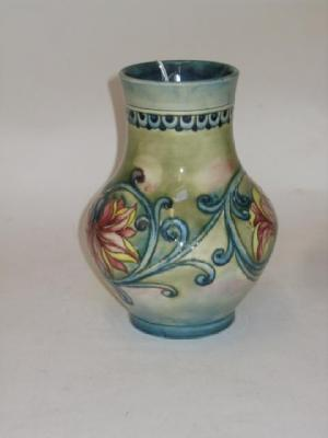 A WALTER MOORCROFT POTTERY VASE of baluster form tube lined