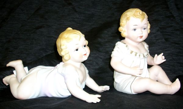 Pair of KPM Polychromed Biscuit Porcelain Piano Baby Figures first