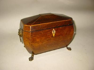 A REGENCY ROSEWOOD TEA CADDY of sarcophagus form with box