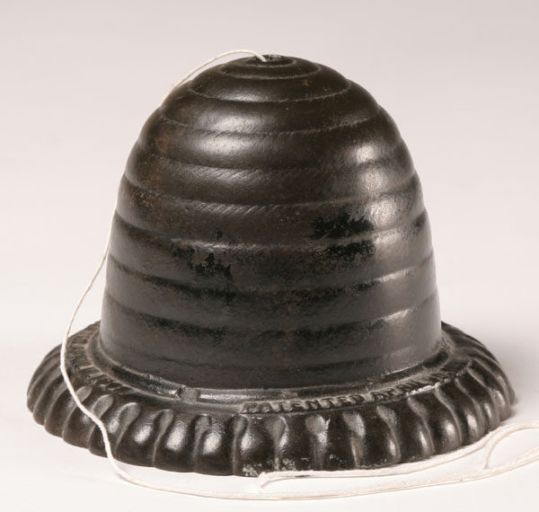 Cast metal string holder beehive shape embossed patent dates on