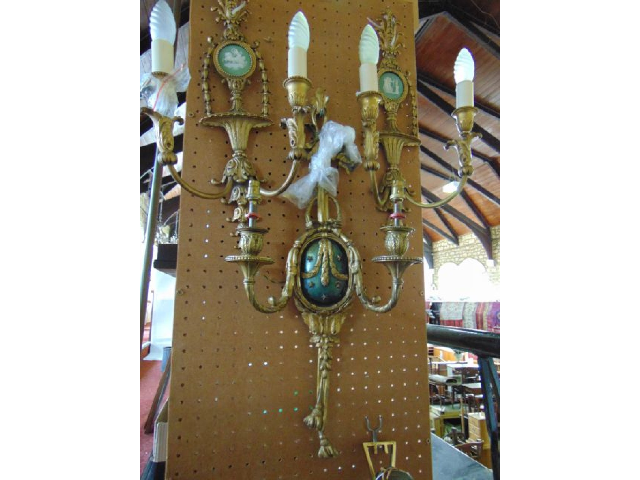 A single cast brass two branch wall light in the