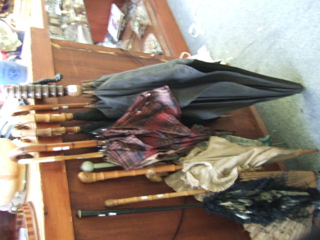 A selection of eleven various parasols circa 1900 and later