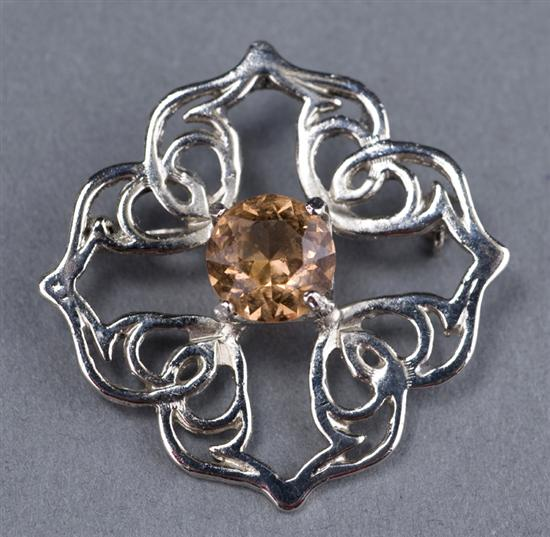 Silver pin in Celtic design with peach topaz Pin is