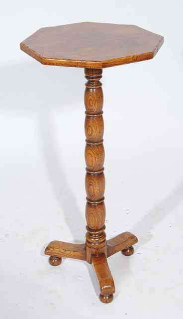 AN OAK OCTAGONAL TOPPED WINE TABLE with bobbin and reel