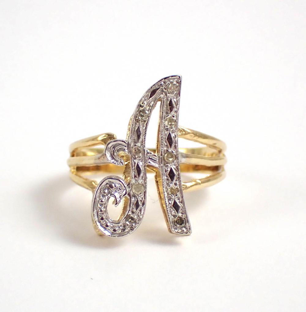DIAMOND AND FOURTEEN KARAT YELLOW AND WHITE GOLD SPLIT SHANK
