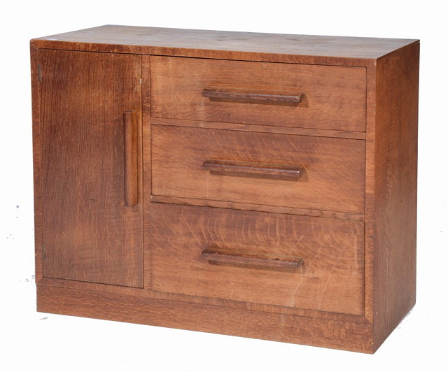 AN ART DECO STYLE OAK CUPBOARD fitted an arrangement of