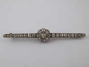 An Edwardian gold and old brilliant cut diamond brooch the