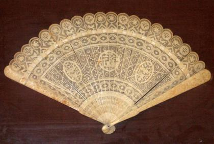 Carved ivory fan Mounted in a shadow box with John