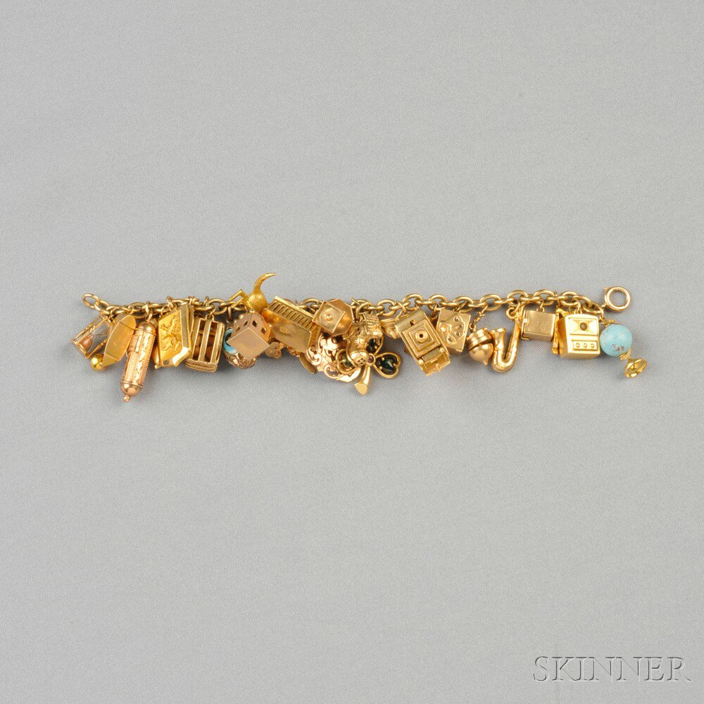 Gold Charm Bracelet composed of thirty 18kt 14kt and 10kt